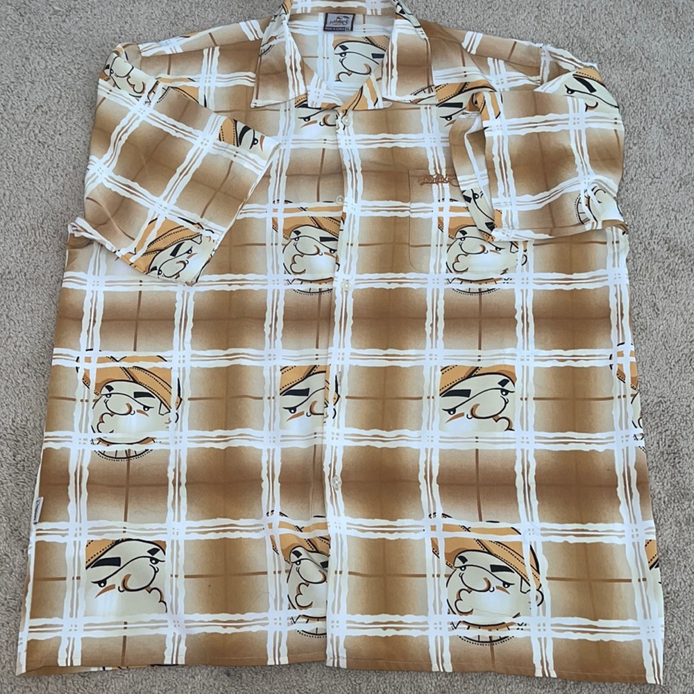 Shirt with a bunch of heads on it